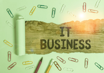 Writing note showing It Business. Business concept for organization uses information technology to achieve goals