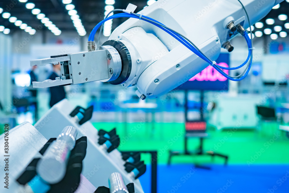 Poster the robot arm manipulator. robot for the assembly of metal products. robot on the background of engi