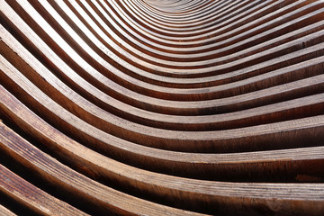 Abstract background of brown wooden curves. Smooth bends