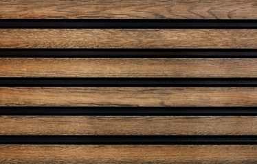 Fototapeta premium Smooth wooden horizontal guides are symmetrically located relative to each other.