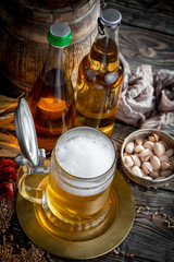 Light beer in a glass, on an old background.