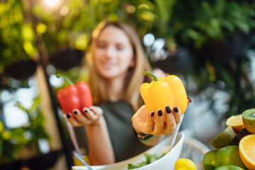 Close up photo, woman holding peeper, healthy food and dieting time