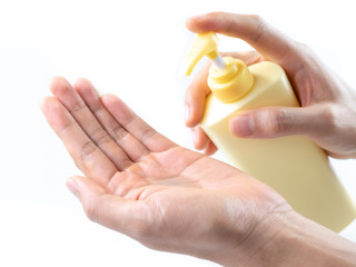 Man washing hands with sanitizer gel bottle or soap for coronavirus prevention, hygiene to stop spreading covid-19 (select focus)