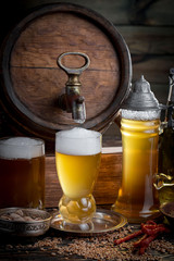 Light beer in a glass, on an old background.