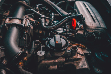 closeup of car turbo engine with oil filler neck for lubrication of internal parts and turbine