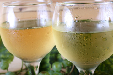 Grape and wine on table