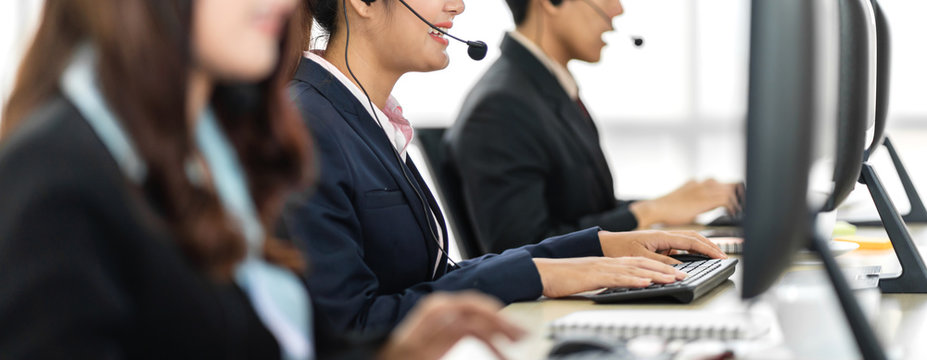 Group Of Happy Call Center Smiling Business Operator Customer Support Team Phone Services Agen Working And Talking With Headset On Desktop Computer At Call Center