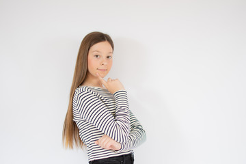 Obraz premium Smiling young girl with striped shirt smiling