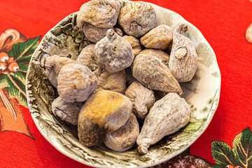 dried figs in a bowl on a table
