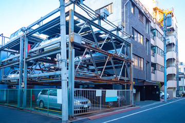 Japan. Tokyo. Cars in a multi-level auto parking in Japan. Automated parking station in Tokyo. Multi-storey outdoor parking place. Cars in a japanese city. Modern technology in Japan.