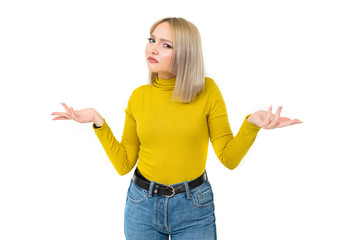 cute blonde girl in casual style waving her arms displeased on a white background with copy space