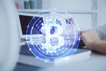 Cryptocurrency hologram over hands taking notes background. Concept of blockchain. Multi exposure