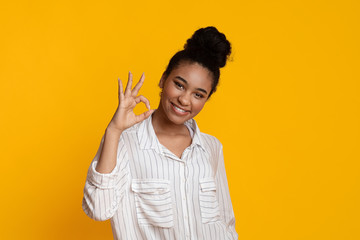 Positive Black Girl Showing Ok Gesture And Sincerely Smiling