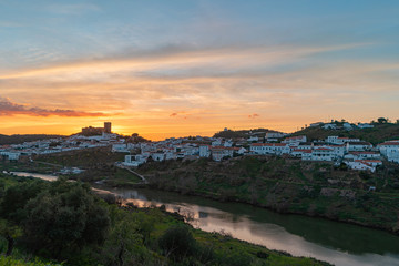 Fototapeta na wymiar Sunset in Mertola, village of Portugal and its castle. Village in the south of Portugal in the region of Alentejo.