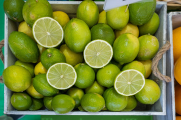 Obraz na płótnie Canvas Background of beautiful lime fruits at an agricultural exhibition