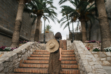 young tourist woman in the streets of the old town of Peniscola, Spain