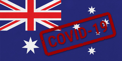 Flag of Australia on paper texture with stamp, banner of Coronavirus name on it. 2019 - 2020 Novel Coronavirus (2019-nCoV) concept, for an outbreak occurs in the Australia.