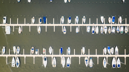 harbour in the winter with sailing boats and yachts shot from above in the netherlands, holland, flevoland, almere, amsterdam