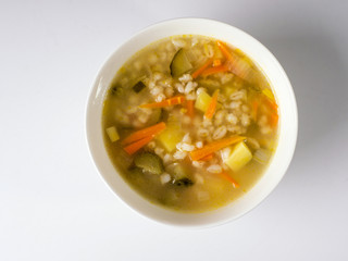 Russian soup Rassolnik in a white deep plate. View from above
