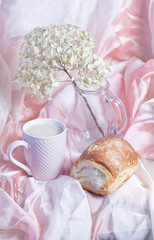 cup of coffee and cake on wooden table