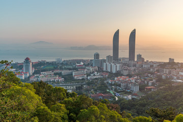 Obraz premium Aerial view of Xiamen cityscapes at dusk, skyline and the seascape during the sunset, Fujian China