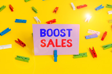 Handwriting text writing Boost Sales. Conceptual photo move sales profit from a lower to a higher...