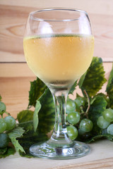 Grape and wine on table