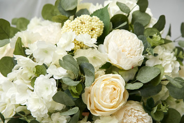 A large beautiful bouquet of white flowers with greenery. Natural, fresh flowers.