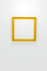 3D rendering gold frame on white wall mockup