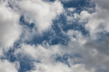 Obraz premium Light fluffy white clouds on a blue sky