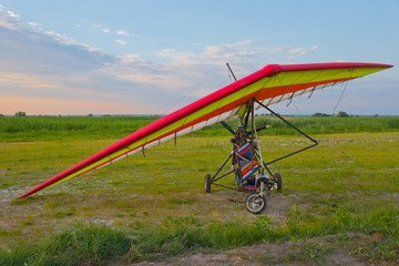 Two-seat paraglider with a three-bladed propeller.