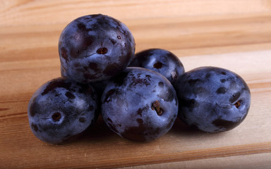 Plums on table
