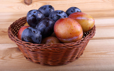 Plums on table
