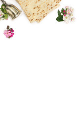 Matzo, silver bowl and pink flowers apple tree for passover celebration on white background with space for text. Top view, flat lay