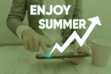 Conceptual hand writing showing Enjoy Summer. Concept meaning taking a break from school and...