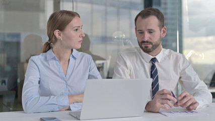 The Business people Sharing Idea on Laptop in Office