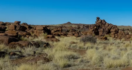 Fotobehang Giant's Playground ("Speelplek van die reuse") near Keetmanshoop, home of rocks and quiver trees (Kokerboom) © Helge