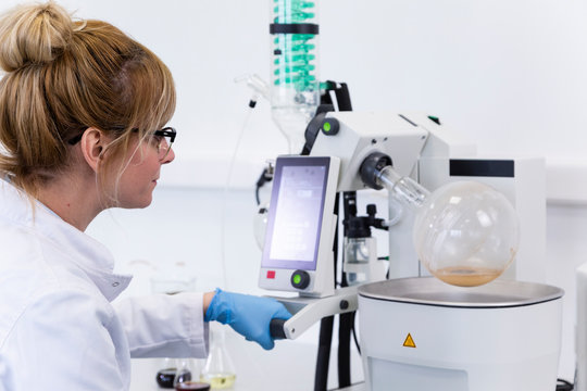 Chemist extracting cbd with rotavapor in laboratory