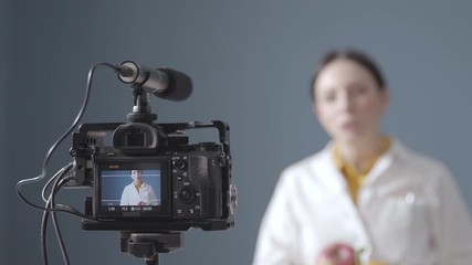 Professional nutritionist shooting a video for her channel - Powered by Adobe