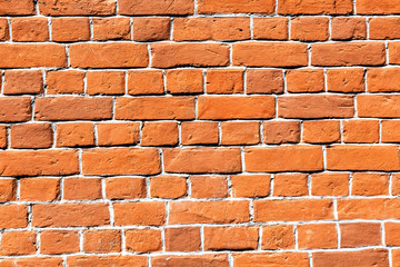 Old weathered red brick wall