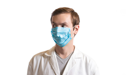 portrait of a guy in a disposable mask and a medical coat on a white background