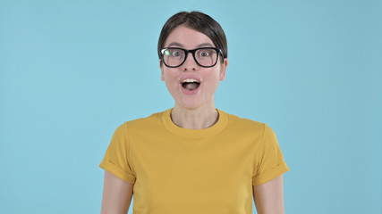 The Happy Young Woman Surprised on Blue Background