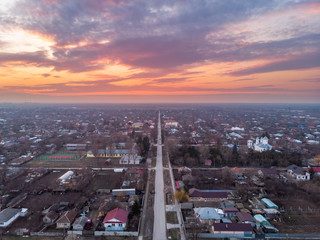 Aerial sunset landscape took above a street in Mihail Kogalniceanu, Ialomita, Romania