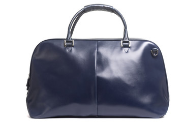 leather female blue bag on the handle on a white background