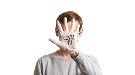 palm in a medical glove in the face with the abbreviation COVID-19
