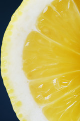 juicy fresh ripe lemon in a section close-up, macro