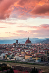 Fototapeta na wymiar Amazing colorful sunset view of Florence city, Italy with the river Arno and Cathedral of Santa Maria del Fiore.