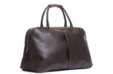leather female brown bag on the handle sideways on a white background