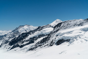Fototapeta na wymiar Panoramic view on winter snowy mountains at nice sunny evening.