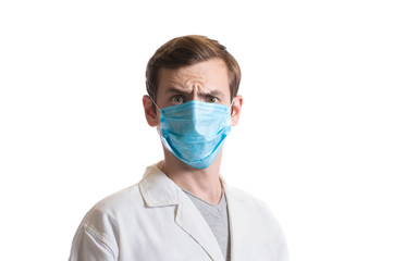 portrait of a guy in a disposable mask and a medical coat on a white background